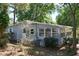 Charming home featuring a well-maintained exterior, sunroom, and landscaping at 17108 Pine Ridge Dr, Umatilla, FL 32784