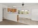 Spacious living room with view to bright kitchen at 17108 Pine Ridge Dr, Umatilla, FL 32784