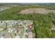 Aerial view showing the home's location nestled among mature trees in a suburban neighborhood at 17883 Se 125Th Cir, Summerfield, FL 34491