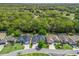 Aerial view showcasing the property's lush greenery and well-maintained landscaping in a suburban neighborhood at 17883 Se 125Th Cir, Summerfield, FL 34491