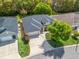 Aerial view of a well maintained home featuring a pristine lawn and an attached two-car garage at 17883 Se 125Th Cir, Summerfield, FL 34491