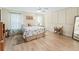 Comfortable bedroom featuring a ceiling fan, stylish curtains, and hardwood flooring at 17883 Se 125Th Cir, Summerfield, FL 34491