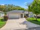 Well-maintained single Gathering home with a 2 car garage and beautiful landscaping at 17883 Se 125Th Cir, Summerfield, FL 34491
