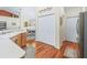 Hallway showcases the dining area and kitchen, and features a decorative flourish above the closet at 17883 Se 125Th Cir, Summerfield, FL 34491