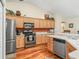 Kitchen with stainless steel appliances and wood cabinets, offering plenty of storage space at 17883 Se 125Th Cir, Summerfield, FL 34491