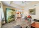 Stylish living room featuring light wood-look floors, bright sunny wall colors, and a view into the kitchen at 17883 Se 125Th Cir, Summerfield, FL 34491