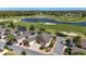 Aerial view of a charming home with gorgeous golf course and lake views at 1907 Anderson Ct, The Villages, FL 32162