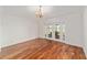 Elegant dining room with hardwood floors and French door access to outdoor patio at 1907 Anderson Ct, The Villages, FL 32162
