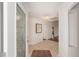 Bright entryway with tiled floors, decorative glass door and a view into the living area at 1907 Anderson Ct, The Villages, FL 32162