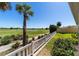 Relax with serene views of the golf course and lake, perfect for leisure living at 1907 Anderson Ct, The Villages, FL 32162