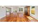 Bright living room with hardwood floors, natural light, and access to outdoor area at 1907 Anderson Ct, The Villages, FL 32162
