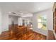 Open-concept living room with beautiful hardwood floors and recessed lighting at 1907 Anderson Ct, The Villages, FL 32162