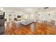 Spacious living room with hardwood floors, bright lighting, and an open design, perfect for entertaining guests at 1907 Anderson Ct, The Villages, FL 32162
