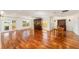 Spacious living room with hardwood floors and elegant furniture, providing a comfortable area for relaxation and entertainment at 1907 Anderson Ct, The Villages, FL 32162