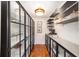 Organized pantry with custom shelving, offering ample storage space for kitchen essentials and accessories at 1907 Anderson Ct, The Villages, FL 32162