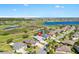 Aerial view of home with water view in a gated community at 2213 Evans Prairie Trl, The Villages, FL 32163
