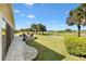 Expansive backyard with paved patio overlooking the golf course at 2213 Evans Prairie Trl, The Villages, FL 32163