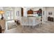 Spacious kitchen with granite countertops, stainless steel appliances, and a breakfast bar with seating at 2213 Evans Prairie Trl, The Villages, FL 32163
