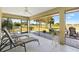 Relaxing screened lanai with ceiling fan and a beautiful view of the golf course at 2213 Evans Prairie Trl, The Villages, FL 32163