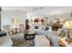 Bright and airy living area features neutral tones, tile floors, and an open-concept design at 2213 Evans Prairie Trl, The Villages, FL 32163