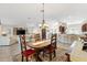 Open layout with living room, dining area, and kitchen featuring an expansive living space at 2213 Evans Prairie Trl, The Villages, FL 32163