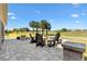 Back patio with ample seating and golf course views at 2213 Evans Prairie Trl, The Villages, FL 32163