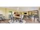 Spacious sunroom with dining and seating areas at 2213 Evans Prairie Trl, The Villages, FL 32163