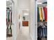 Convenient walk-in closets lead into the main bathroom, complete with storage solutions at 2213 Evans Prairie Trl, The Villages, FL 32163