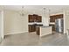 Kitchen with stainless steel appliances and granite countertops adjacent to the dining area and living space at 2520 Tanner Ter, Kissimmee, FL 34743