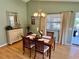 Dining room with hardwood floors, traditional furniture, and ample natural light at 2569 Errol Ter, The Villages, FL 32162
