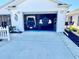 Spacious two car garage holding a white Jeep and a golf cart at 2569 Errol Ter, The Villages, FL 32162