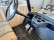The inside view of a golf cart showing the steering wheel at 2569 Errol Ter, The Villages, FL 32162