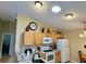 Bright kitchen featuring updated appliances and granite countertops at 2569 Errol Ter, The Villages, FL 32162