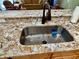 Kitchen sink features granite countertops at 2569 Errol Ter, The Villages, FL 32162