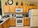 Well-lit kitchen features granite countertops and stainless steel appliances at 2569 Errol Ter, The Villages, FL 32162