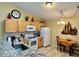 Bright, sunny kitchen with tile countertops, ample counter space, and modern appliances at 2569 Errol Ter, The Villages, FL 32162