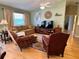 Inviting living room with vaulted ceilings and neutral tones throughout at 2569 Errol Ter, The Villages, FL 32162