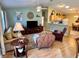 Inviting living room with open floor plan to kitchen, ideal for entertaining guests at 2569 Errol Ter, The Villages, FL 32162