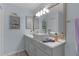 Bathroom featuring a modern vessel sink, vanity, and decorative accents at 2716 Benavides Dr, The Villages, FL 32162