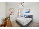 Cozy bedroom features a ceiling fan, carpeted floors, and calming decor at 2916 Canary Ln, Tavares, FL 32778