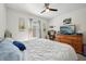 Bedroom with ample natural light, dresser, television, and closet space at 2916 Canary Ln, Tavares, FL 32778
