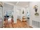 Hallway with hardwood flooring leading to the living spaces and bedrooms at 2916 Canary Ln, Tavares, FL 32778