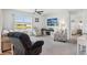 Bright living room with fan and great view of the lake and backyard at 2916 Canary Ln, Tavares, FL 32778