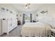 Bright bedroom with neutral decor, carpet, dresser and backyard views at 2916 Canary Ln, Tavares, FL 32778