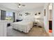 Inviting main bedroom with neutral decor, bright window and access to the bathroom at 2916 Canary Ln, Tavares, FL 32778