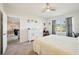 Cozy main bedroom with serene views of the pond through the large window at 2916 Canary Ln, Tavares, FL 32778