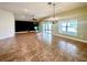Inviting living area with tile floors, a ceiling fan, and sliding glass doors that lead to the outdoors at 30454 Island Club Dr, Deer Island, FL 32778