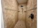 Shower with neutral colored tile surround and decorative accent stripe at 30454 Island Club Dr, Deer Island, FL 32778