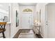 Bright entryway featuring hardwood floors, a decorative table, and art at 6152 Topsail Rd, Lady Lake, FL 32159