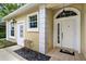 Home's entryway featuring a decorative front door with glass accents at 6152 Topsail Rd, Lady Lake, FL 32159